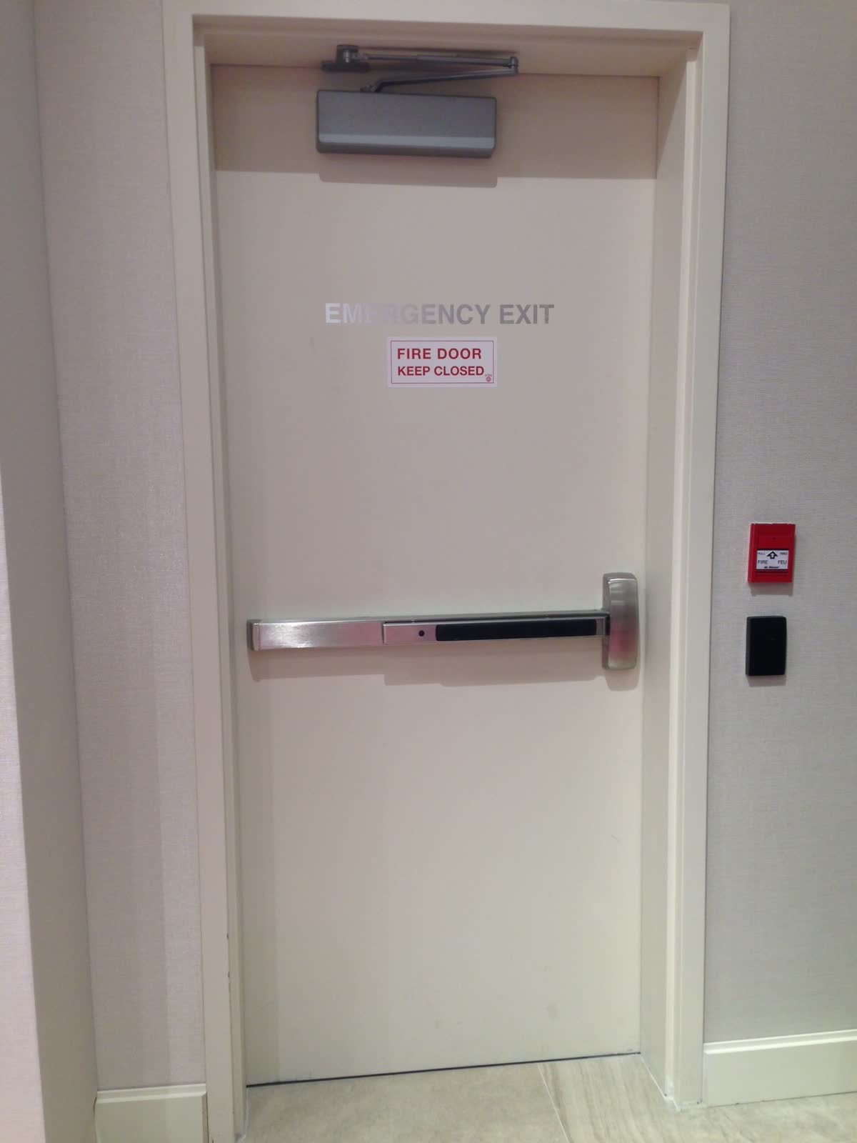 Access controlled door with panic bar, fire alarm call point and card reader