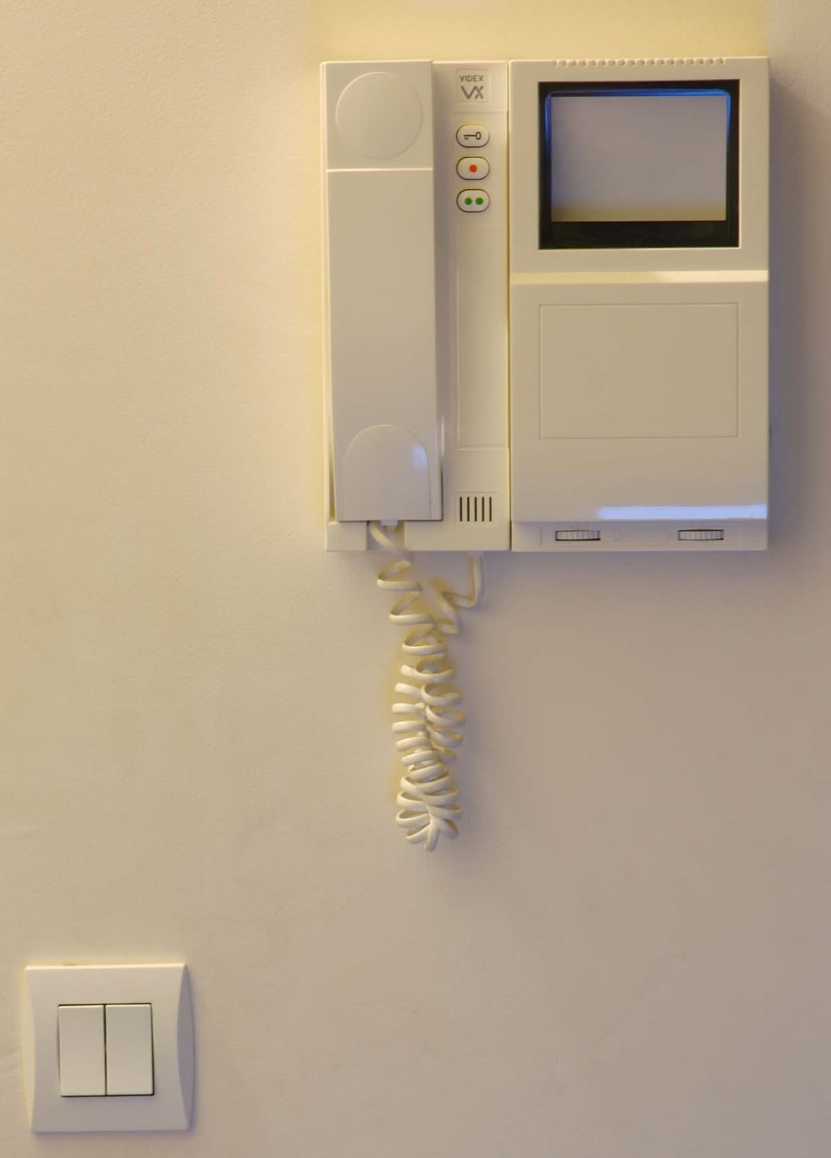Indoor intercom handset on a wall