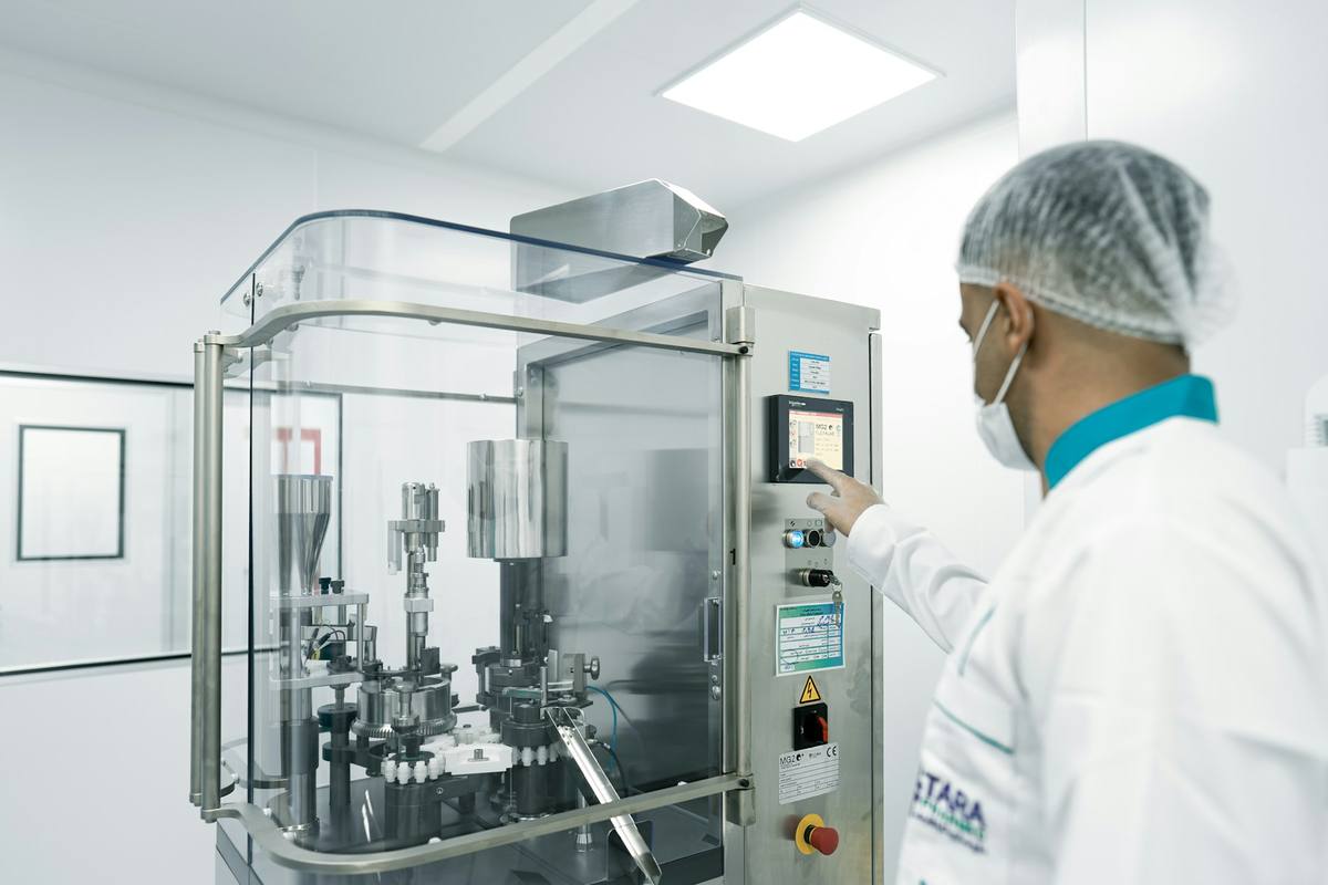 Sample verification at a factory: checking the sample against the spec sheet and recording the result