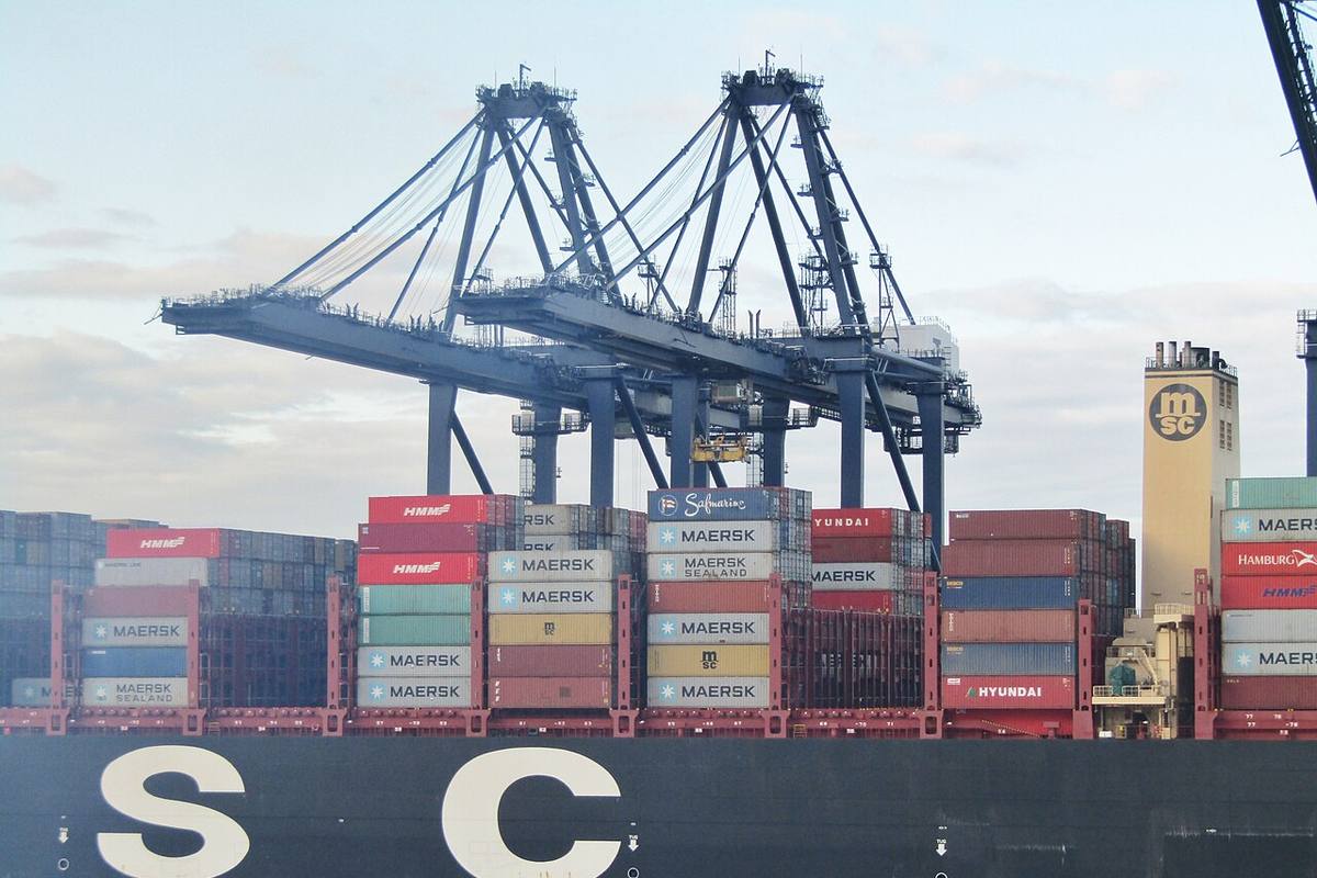 A DDP shipment moving from factory consolidation through clearance to the buyer's door