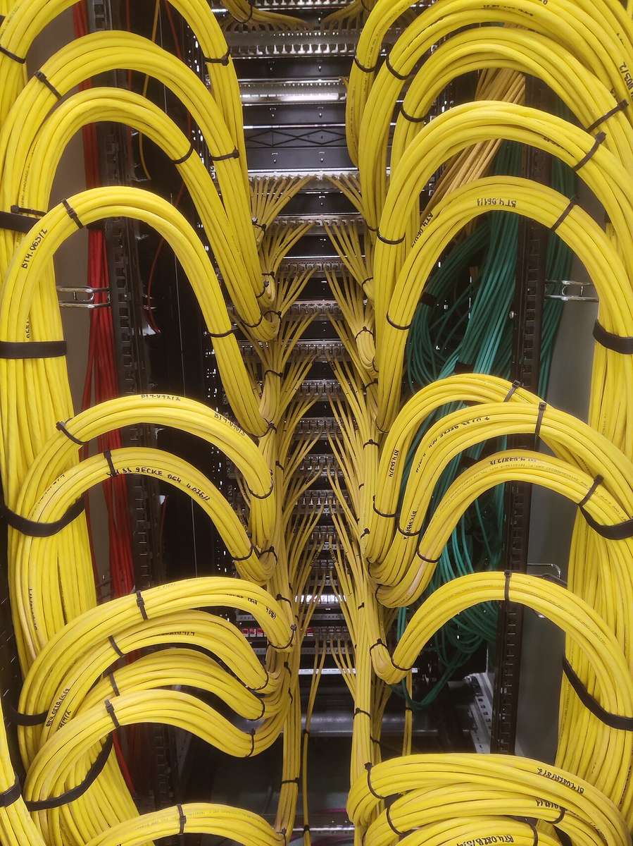 Patch panel and network cables in a rack — where PoE power is delivered