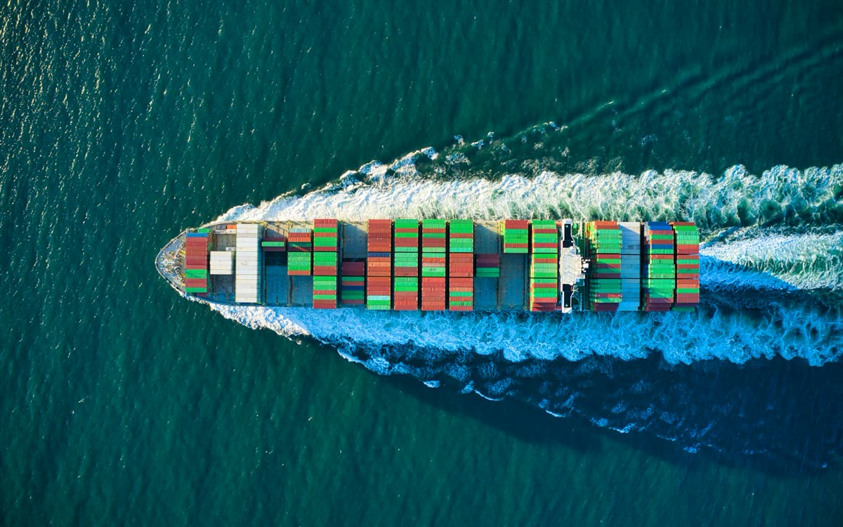 Container ship at sea carrying export cargo from China to Europe