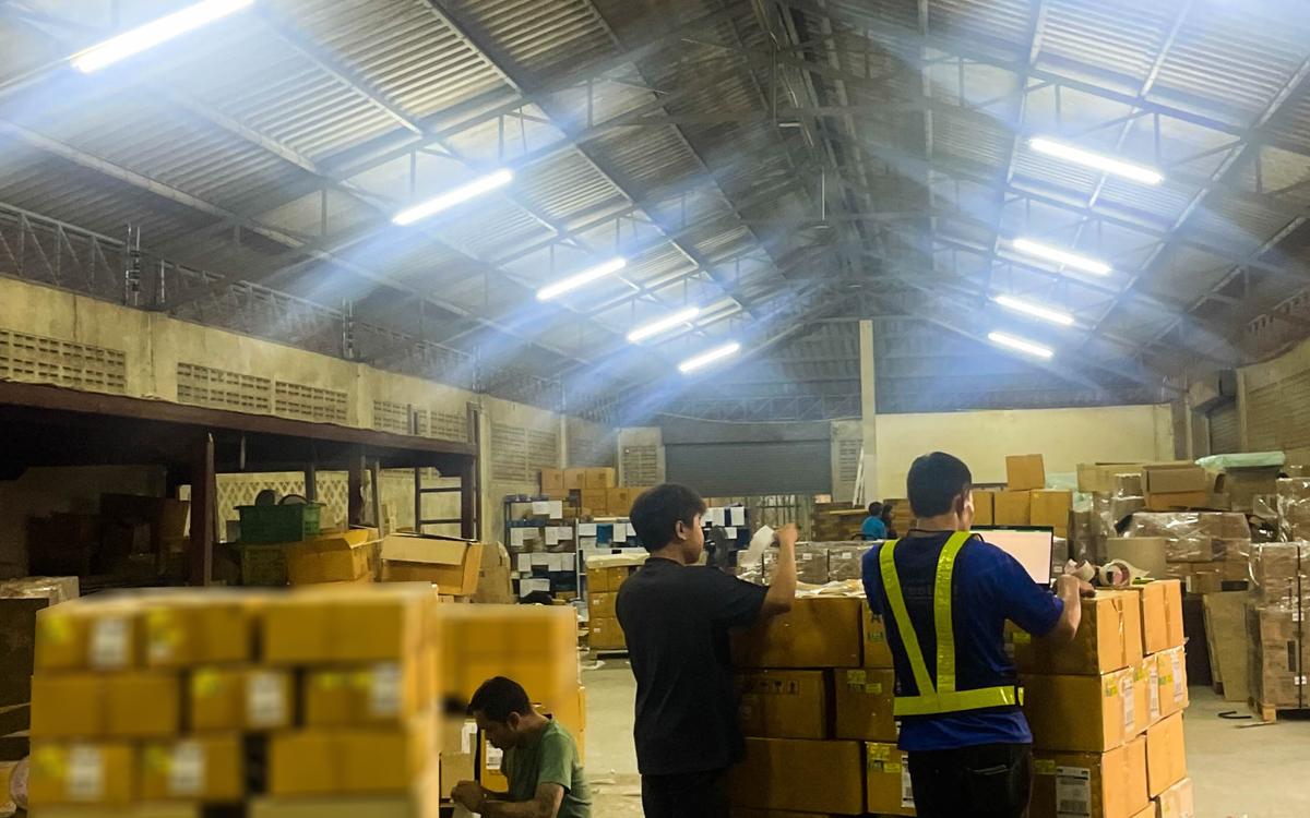 Palletised cargo being loaded inside a shipping container
